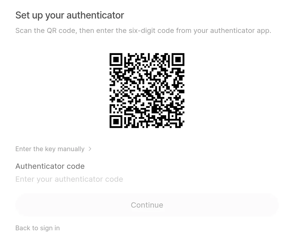 The Set up your authenticator screen with a QR code, Enter the key manually and the Authenticator code field